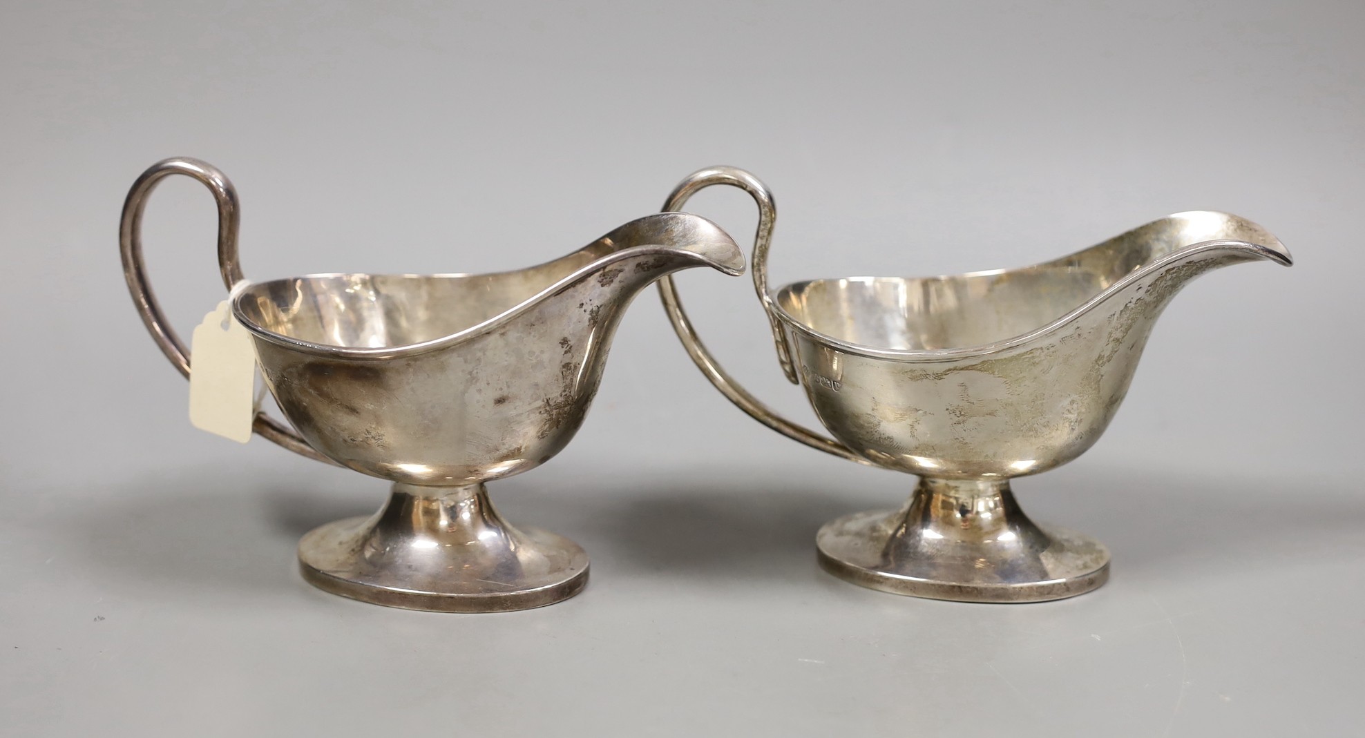 A pair of George V silver pedestal sauceboats, William Hutton & Sons, Sheffield, 1916, 11.4oz.